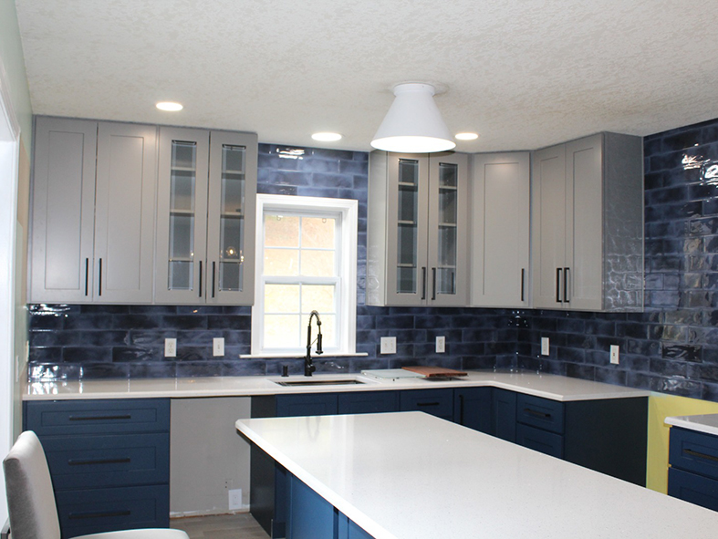 Custom Kitchen Remodeling - Elegant grey and blue Shaker cabinets with quartz countertop and blue backsplash