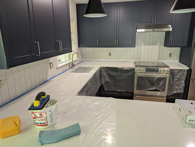 Custom Kitchen Remodeling - Navy blue Shaker cabinets with white quartz countertop