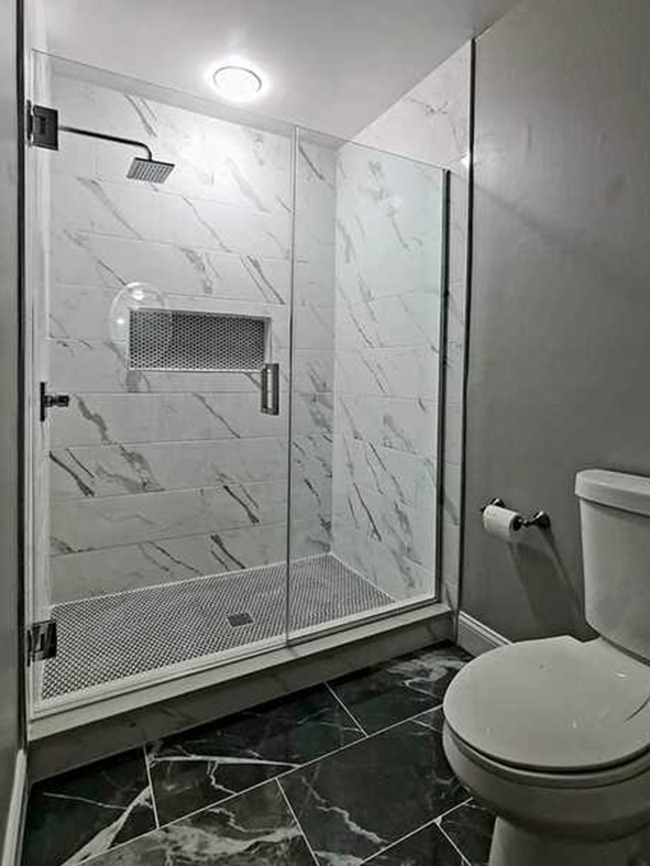 Custom bathroom remodeling Asheville - penny tile flooring with white marble